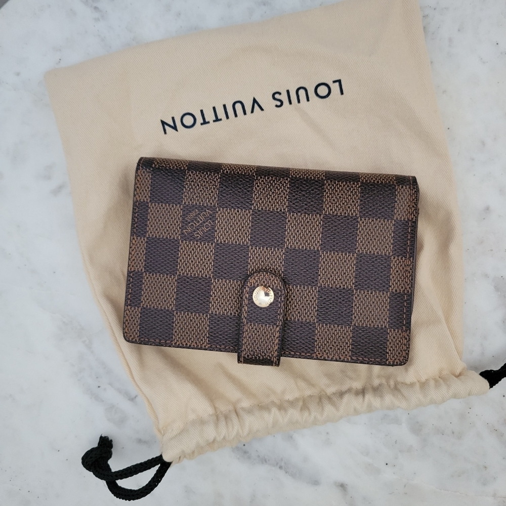 Louis Vuitton Damier Ebene canvas wallet.